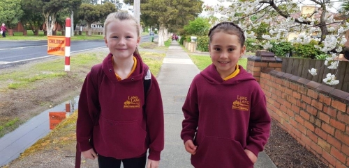 Two girls walking to school in Lang Lang.