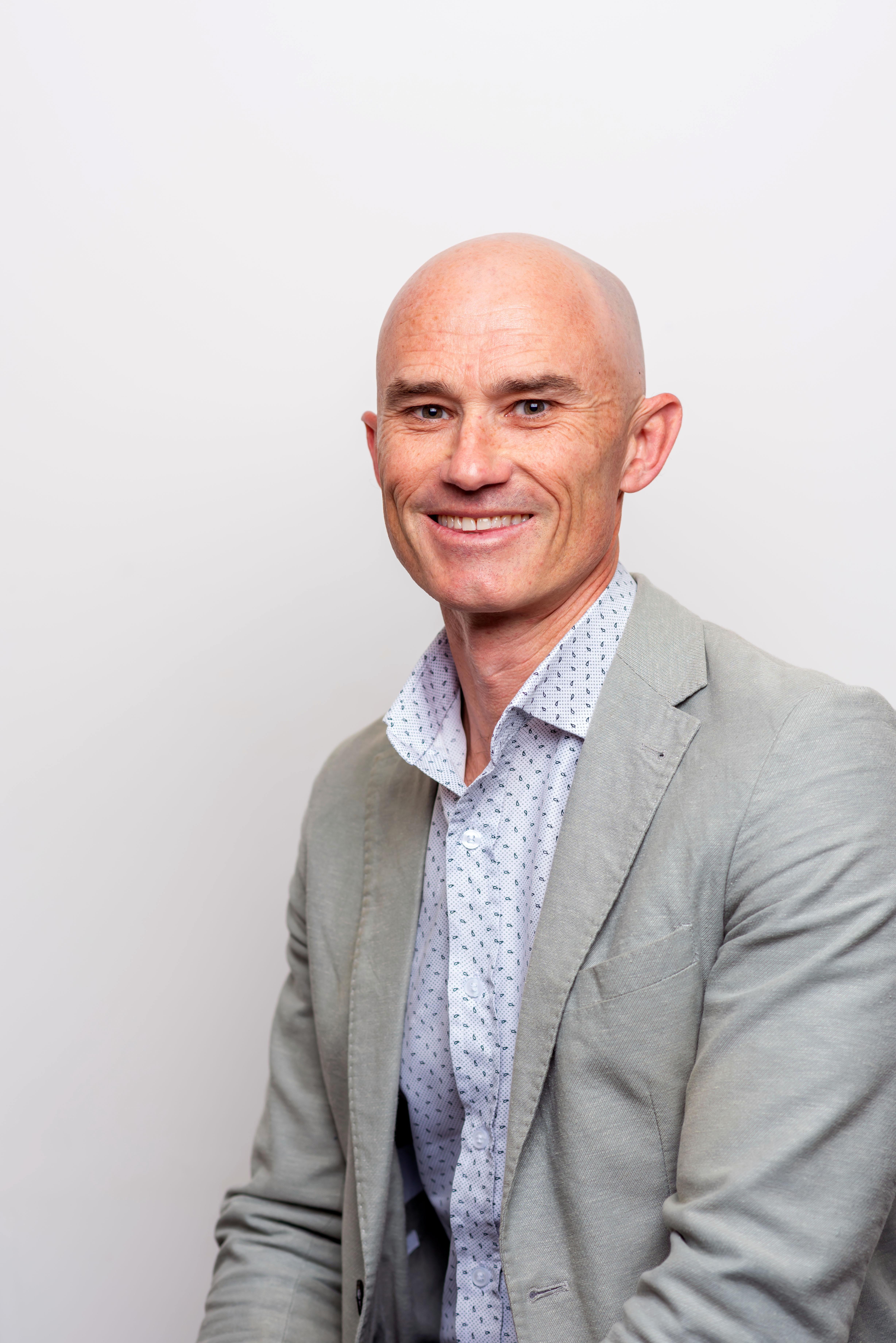 Headshot of James Collins in 2025