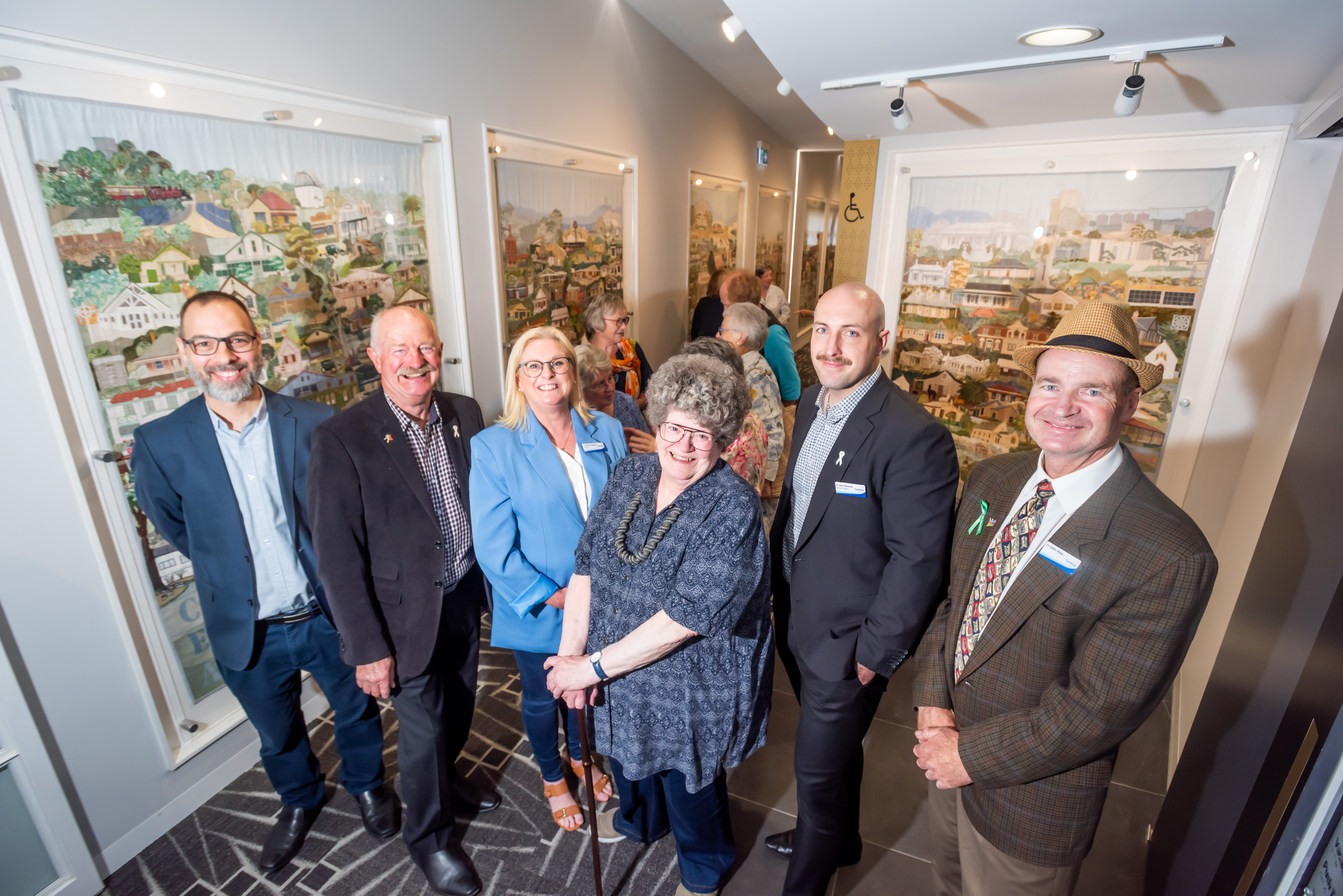 (From left): Coordinator of Arts & Creative Industries James Fischer, Cr. Graeme Moore, Mayor Cr. Tammy Radford, Eleanor Taylor, Cr. Jack Kowarzik and Cr Collin Ross standing with The Cardinian Embroidery at Cardinia Cultural Centre.