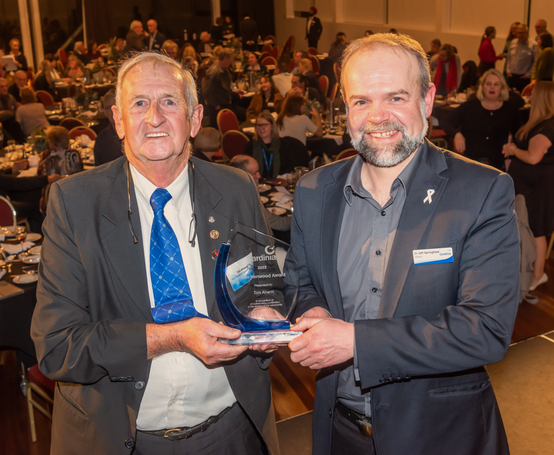 Tim Ahern and Mayor Cr Jeff Springfield holding the Stan Henwood trophy.