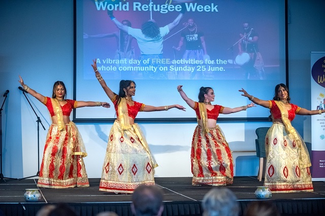 Image of the inaugural Cardinia's Refugee Festival with the Bollydazzlers Dancetroupe performing at the main stage, June 2023